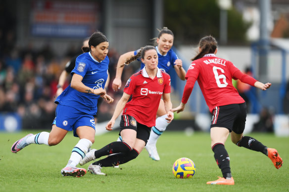 Manchester United's Ona Batlle is pressured by Chelsea striker Sam Kerr at Kingsmeadow on Sunday.