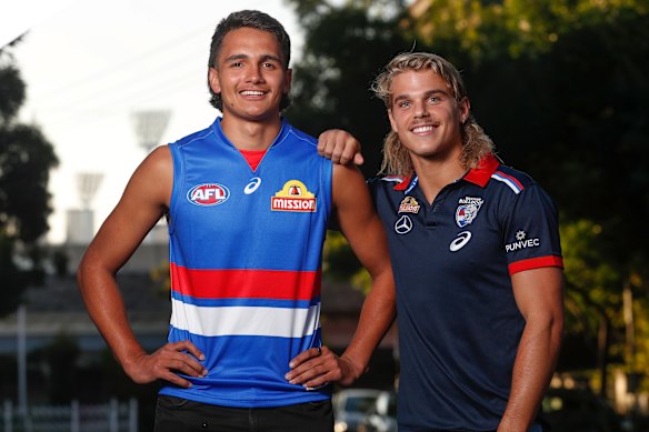 Bailey Smith (right) with Ugle-Hagan after the key forward was taken with pick No.1 by the Bulldogs in 2020.