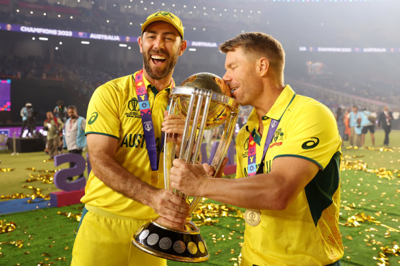 Glenn Maxwell and David Warner with the 50-over World Cup trophy, which Australia held aloft in India in November.