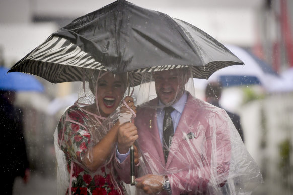 An umbrella, sensible shoes and a sense of humour is required on a soggy race day.