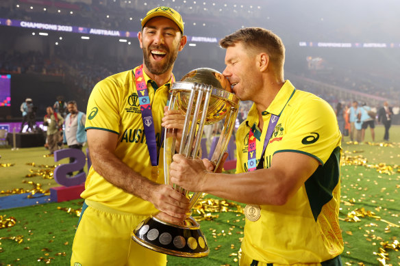 Glenn Maxwell and David Warner with the 50-over World Cup trophy, which Australia held aloft in India in November.