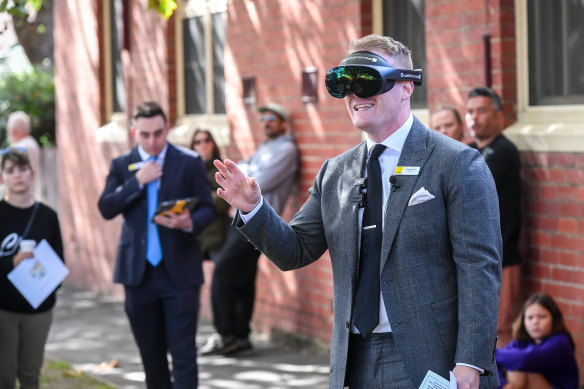 Ray White auctioneer Greg Brydon donned VR goggles to conduct the first virtual live auction.