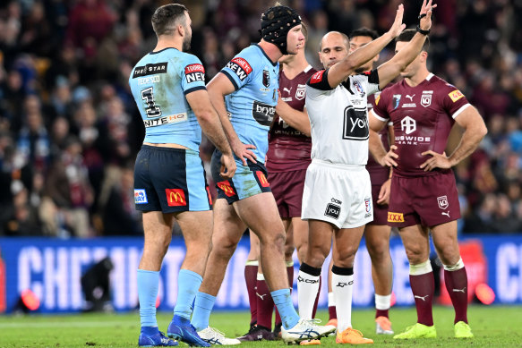 Matt Burton heads to the sin-bin after his set-two with Dane Gagai early in the second half.