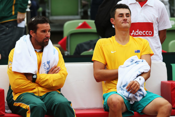 Pat Rafter and a young Bernard Tomic together during the 2012 Davis Cup for Australia.