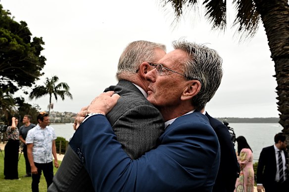 At Kirribilli House, Prime Minister Anthony Albanese embraces Wayne Holdsworth, whose 17-year-old son Mac took his own life after being extorted online.