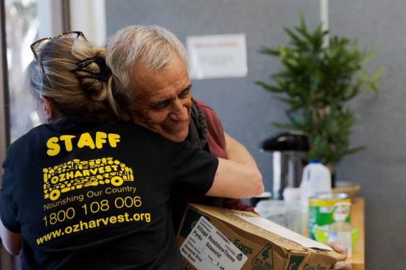 The winning photograph by Melina Muensterman shows a warm embrace between Havafeed Food Rescue coordinator Tracey Talbot and recipient-turned-volunteer Peter.