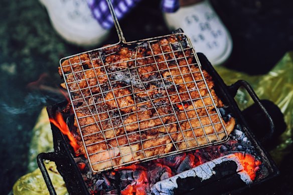 Pork on the grill for bun cha.