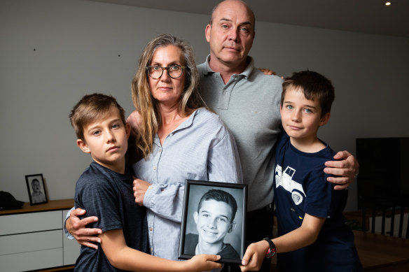 Soren and Ingri Madsen with their children, Philip and William, in their Sydney home. Their eldest son, Victor, has a visa to join them but has been refused a travel exemption to enter the country.