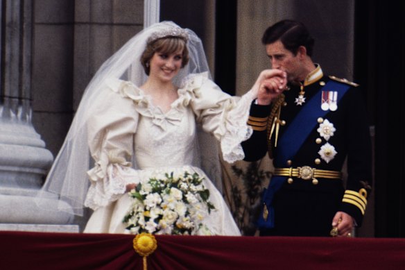 Princess Diana on her wedding day with Prince Charles, wearing an Emanuel wedding on the balcony of Buckingham Palace in 1981.  
