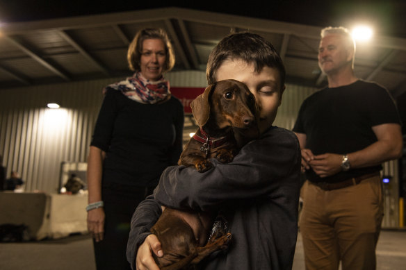 Dachshund Pip reunited at Sydney Airport with the Eilbeck family.