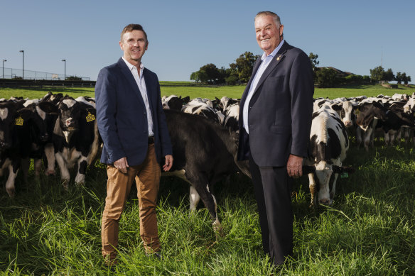 Tony Perich, right, and his son Mark Perich at their dairy farm at Bringelly next to the site of the new airport.
