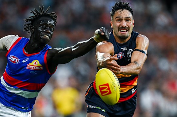 Defensive pressure: Buku Khamis looks to spoil.