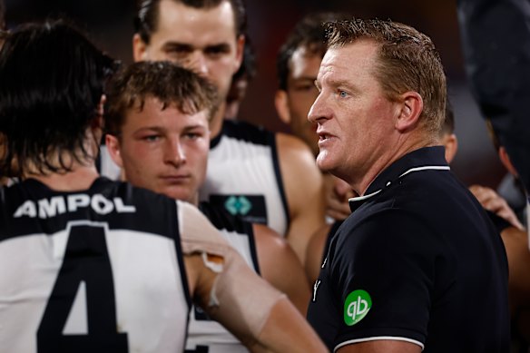 Michael Voss with his players 