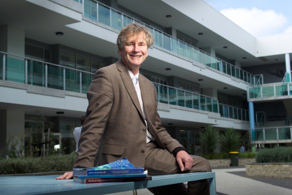 Steven Cook outside the rebuilt Albert Park College in 2011.