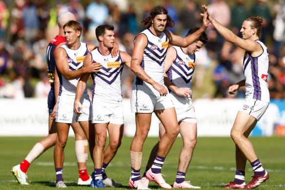 Luke Jackson and Nat Fyfe of the Dockers (right) celebrate during the 2024 AFL Round 12 match between the Melbourne Demons and the Fremantle Dockers at TIO Traeger Park on June 02, 2024 in Alice Springs, Australia.