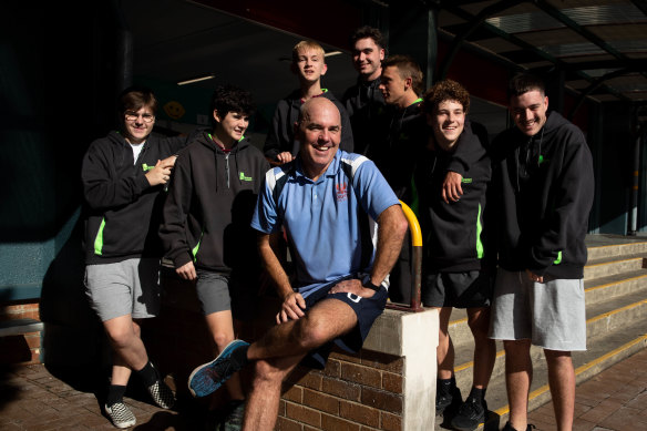 Andrew Horsley with Dapto High School students. He is a mentor to the boys.