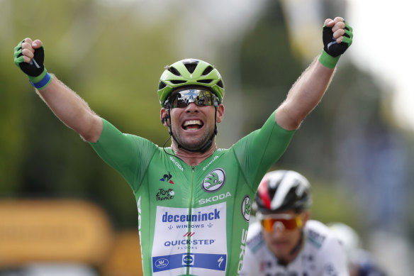Britain’s Mark Cavendish celebrates as he crosses the finish line to win the sixth stage of the Tour.