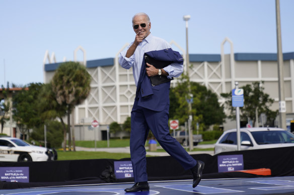 Joe Biden jogs off stage after speaking at a drive-in rally at Broward College in Coconut Creek, Florida, last month.
