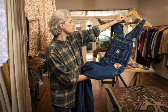 Shop assistant Amy Sather Smith checks the goods at Allegra Benmayor’s Old Flame Studio in Katoomba.