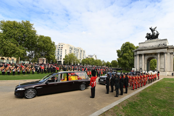 The royal hearse departs Wellington Arch.