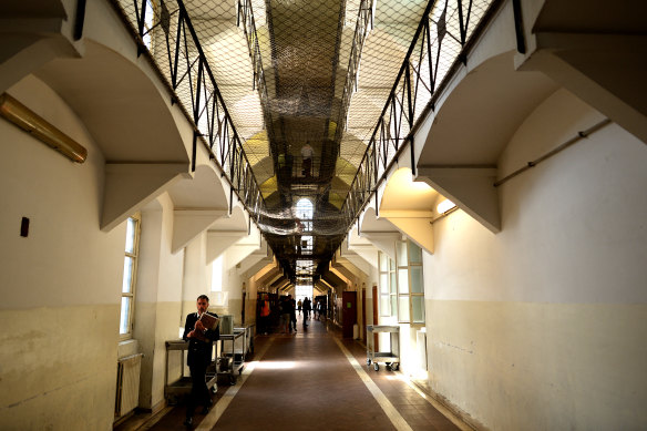 A guard walks down a corridor of Regina Coeli prison in Rome.