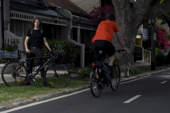 University student Jed Finnane beside the Wilson Street cycleway in Redfern.
