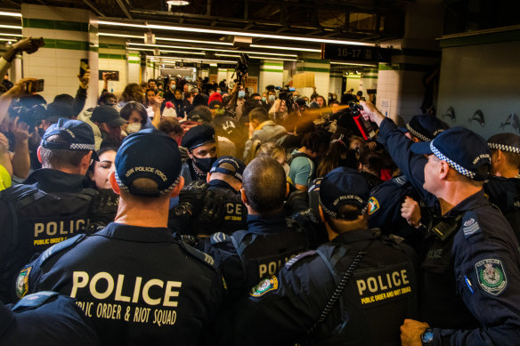 Police use pepper spray on protesters after they were herded into Central Station. 