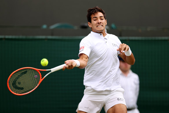 Cristian Garin of Chile plays a forehand against Nick Kyrgios.