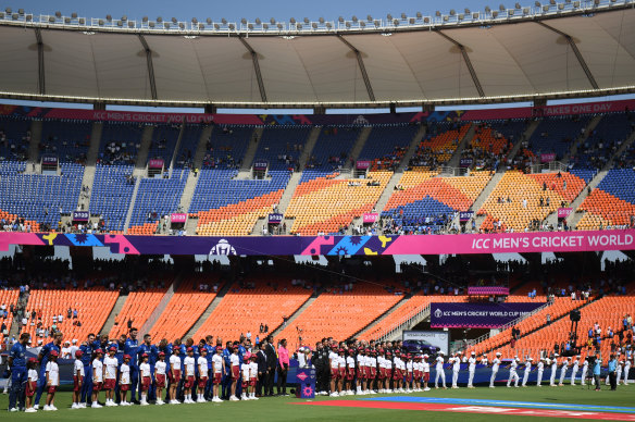 England and New Zealand players line up for the national anthems before the first match.