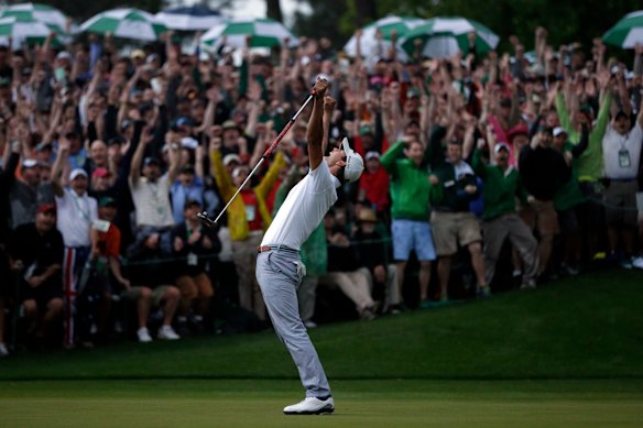 A jubilant Adam Scott celebrates his 2013 Masters win on the second play-off hole at Augusta National.