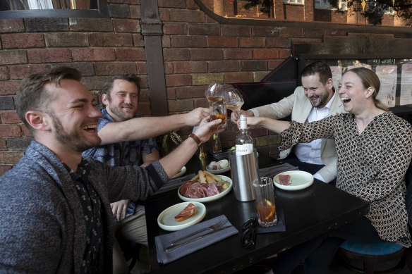 Customers enjoying the atmosphere outside the Roosevelt in Potts Point.