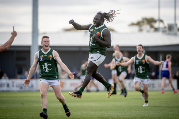 Anthony McDonald-Tipungwuti jumps for joy in Imperials’ premiership win in the Sunraysia Football League.