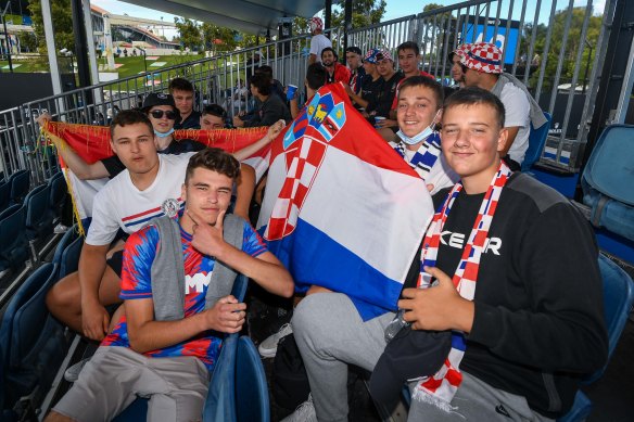 Markus Rajic (bottom left) and his mates with the Croatian flag at the Australian Open.