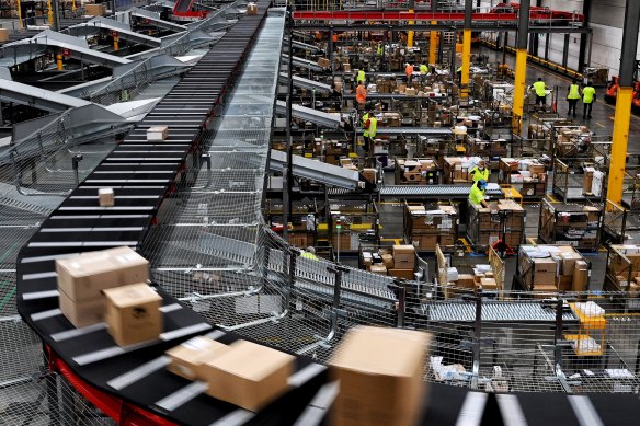 A busy Australia Post parcel distribution centre.