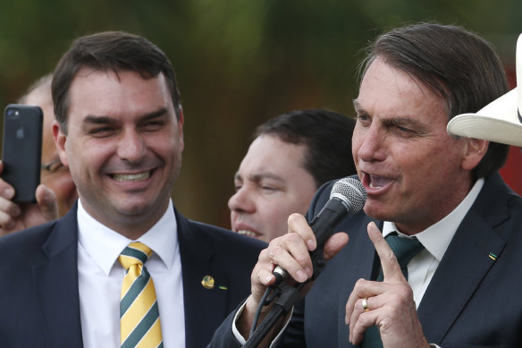 Flavio Bolsonaro, left, with his father, President Jair Bolsonaro, who had promised to tackle endemic corruption in Brazil. 