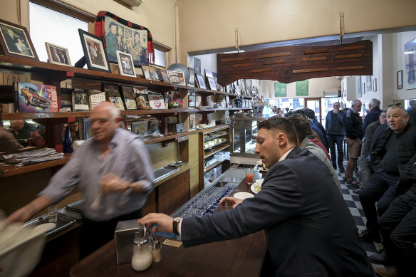 Photos of Sisto, Nino and famous visitors like Russell Crowe and Pierce Brosnan fill the shelves.