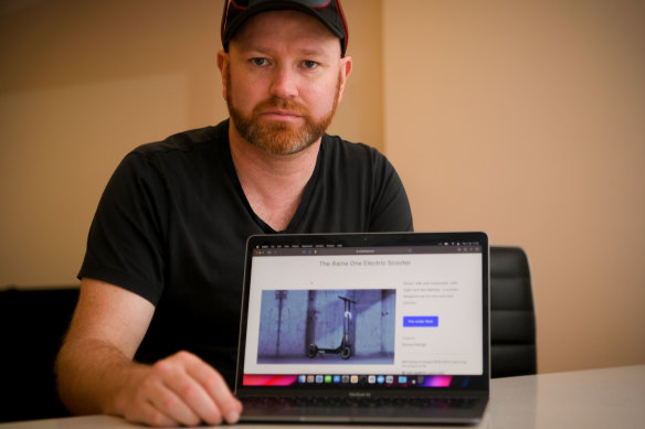 Justin Taylor with a photo of the scooter he fears he may never receive. 