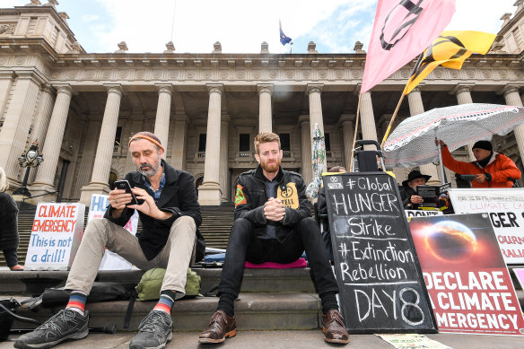 Daniel Bleakley (centre) on the steps of the Victorian Parliament on day 8 of his 10-day hunger strike.