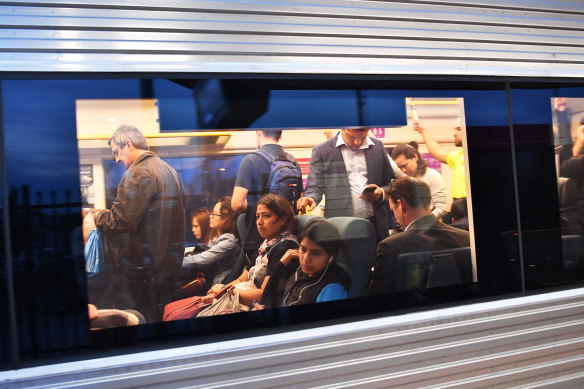 Passengers on an overcrowded V/Line train.