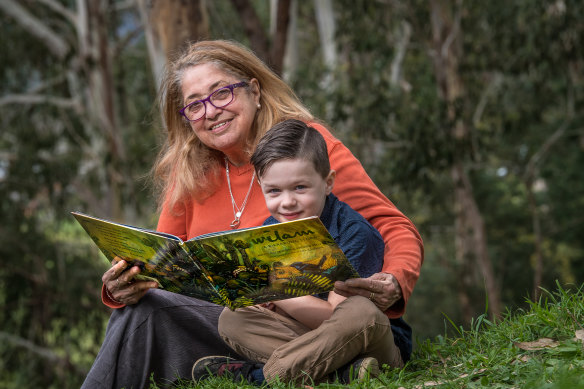 Aunty Joy Wandin Murphy reading her second children's book,  Wilam: A Birrarung Story, to her grandson, Tate Murphy. 