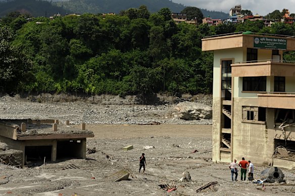 The once-busy town has been reduced to a muddy wasteland by the flood.