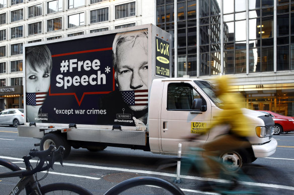 A free speech poster with photos of Chelsea Manning and WikiLeaks founder Julian Assange in Washington.
