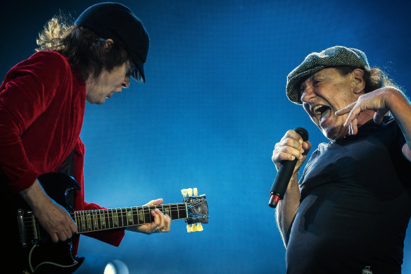 Angus Young (left) and Brian Johnson on stage together in Melbourne in 2016. Johnson is back in the band for AC/DC's new album.