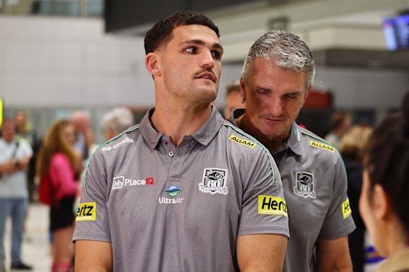 Nathan Cleary (left) and his dad Ivan Cleary at Brisbane airport on Saturday night. 