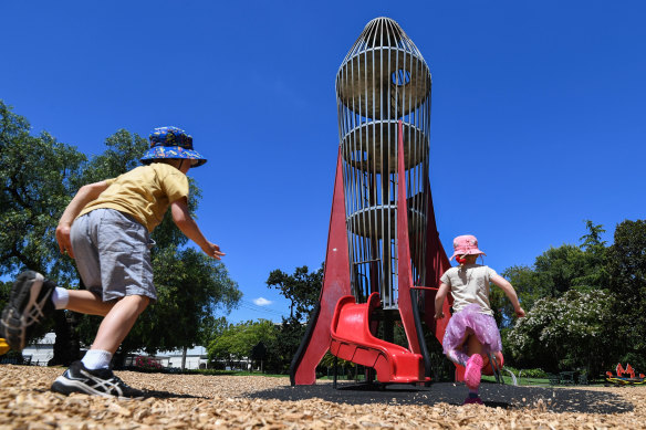 Magnet for kids: Henry and Eloise Gannon play on the rocket tower in Central Gardens, Hawthorn.