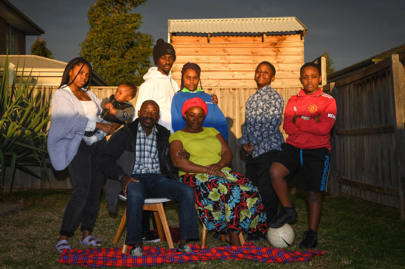 The
Manirakiza family are waiting in hope. Pictured are six of Eimable’s siblings (rear from left), Harmony, Nicholas, Bienvenue, Deborah, Joshua and Brighton, and (seated) stepfather Dismas and mother Benine.