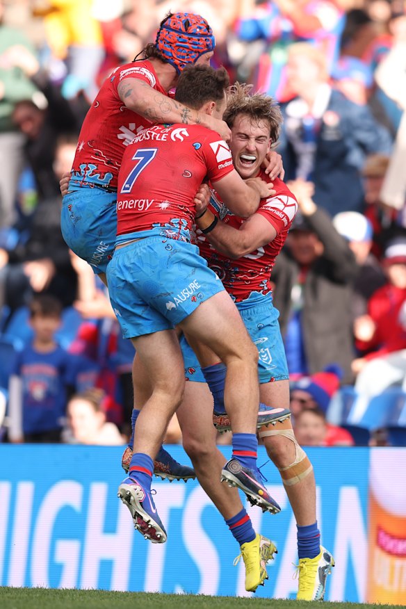 The Knights celebrate  Fletcher Sharpe’s spectacular try on Sunday.
