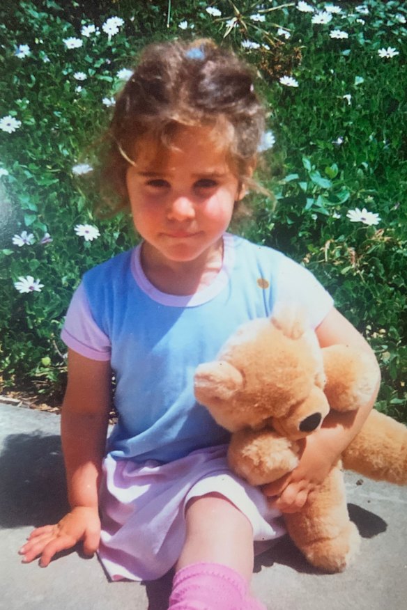 Julia, 4, wearing her favourite pink jelly shoes.