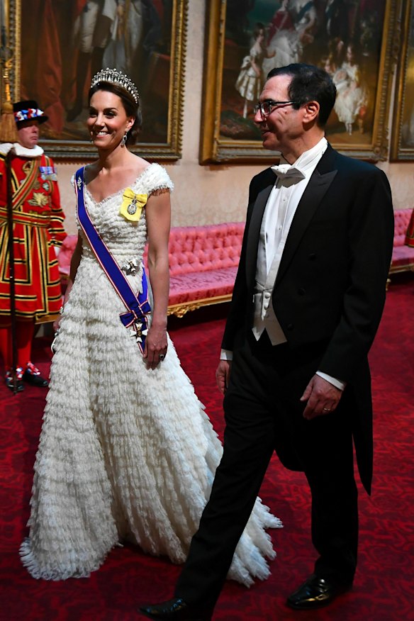 Catherine, the Duchess of Cambridge, and United States Secretary of the Treasury Steven Mnuchin arrive at the State Banquet at Buckingham Palace.