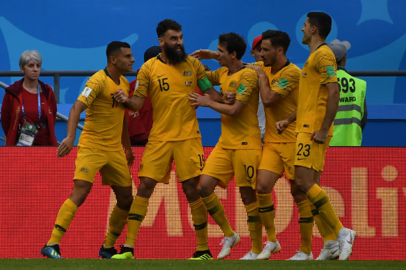 Mile Jedinak celebrates his equalising penalty.